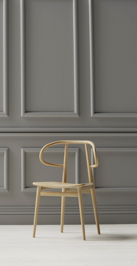 Curve chair in panelled room